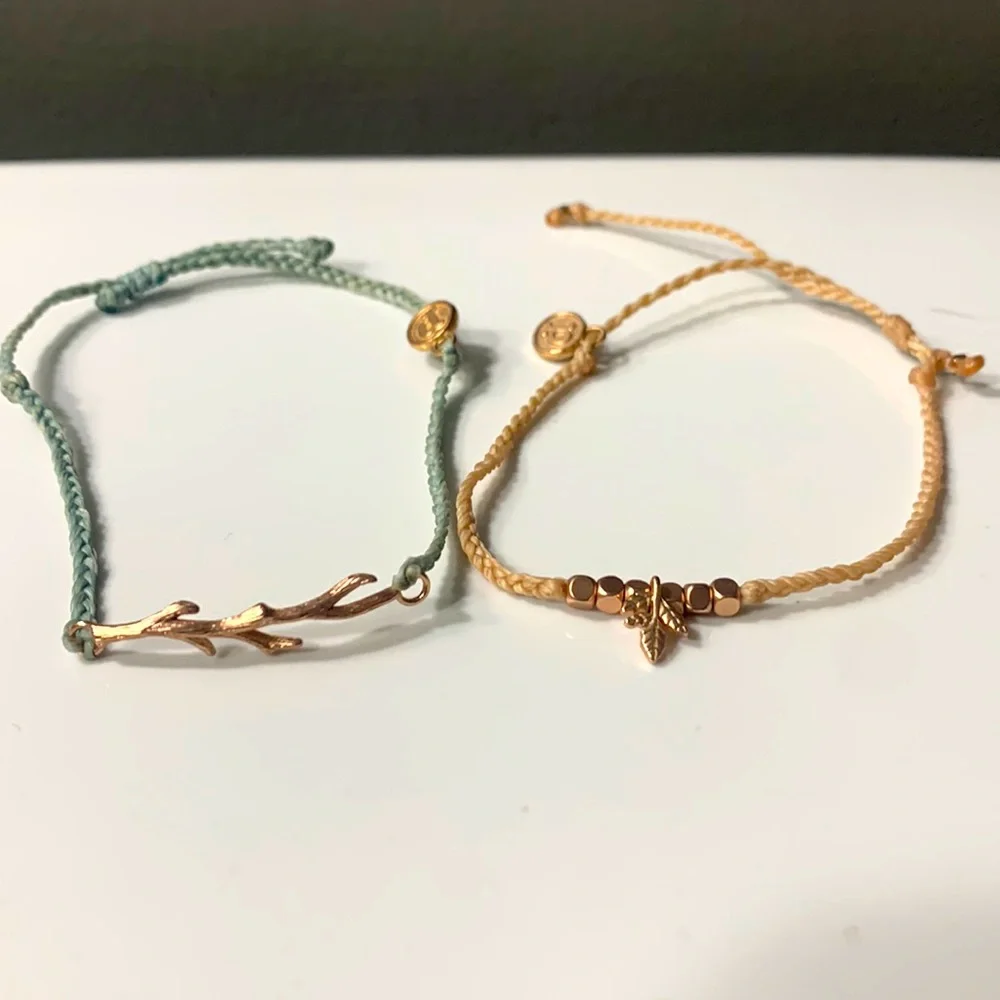 Two rose gold accent pura vida bracelets. Super cute!